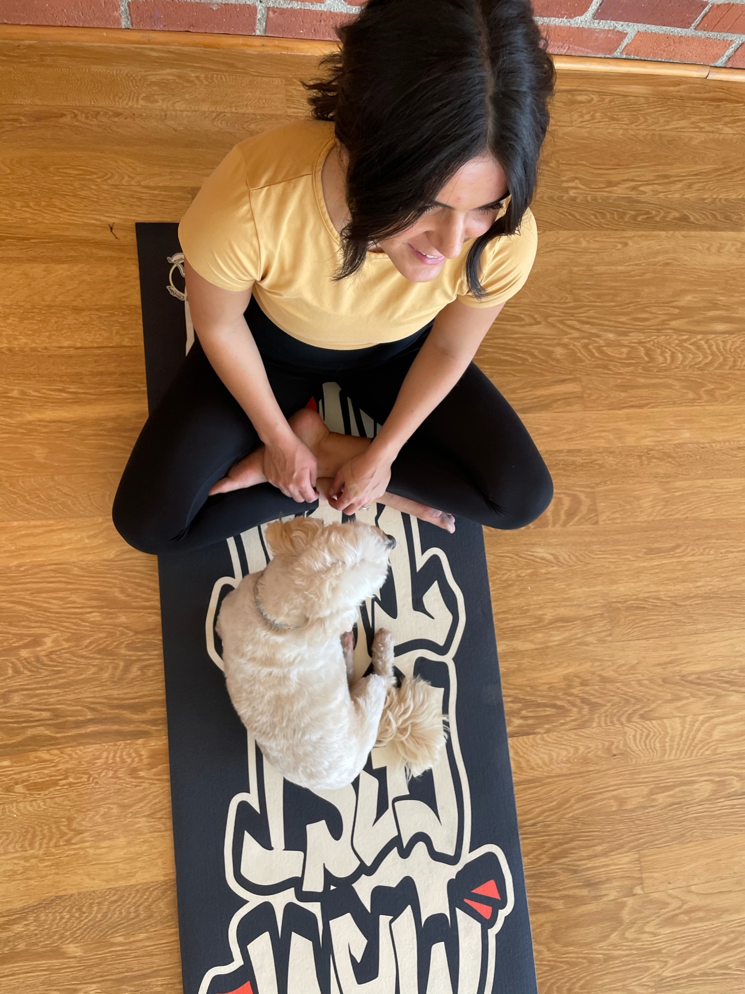 Female pilates instructor and business owner on a yoga mat